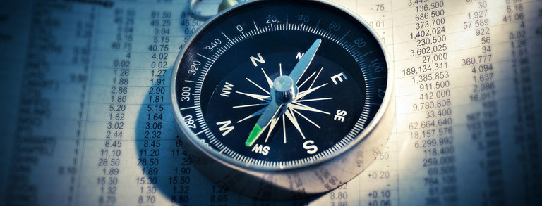 Career Paths_Compass A compass on a sheet of paper with rows of numbers