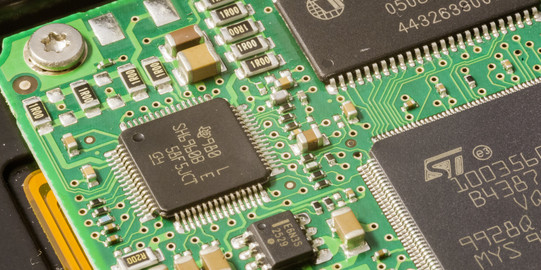 A close-up of a computer board in green.